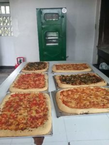 With our custom-made oven,, we baked all of these pizzas at one time!