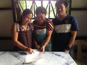 The mothers are signing for their first paycheck!! To God be the glory!!!